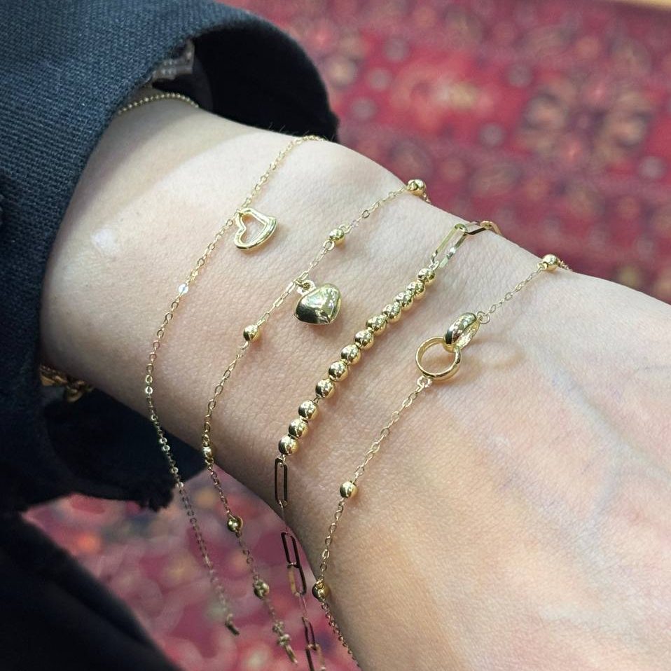 photo_2025-05-22_03-04-50.jpg دستبند طلا با آویز قلب تو خالی